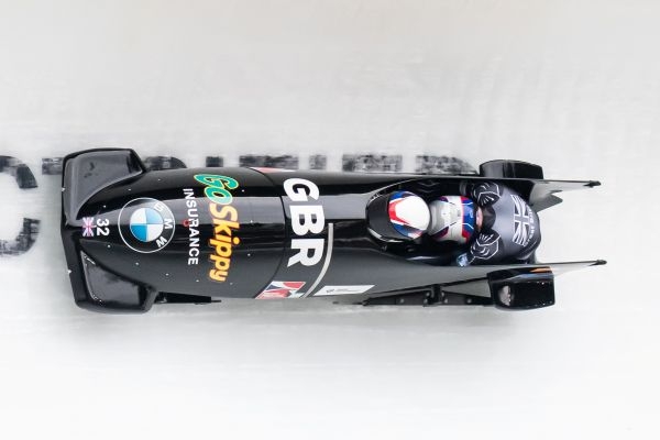 Bobsleigh carrying two athletes in GB kit
