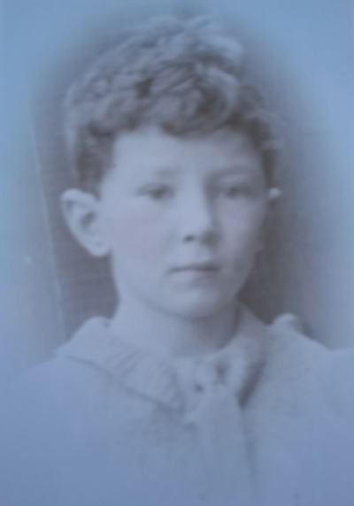 Black an white portrait of young boy with curly hair
